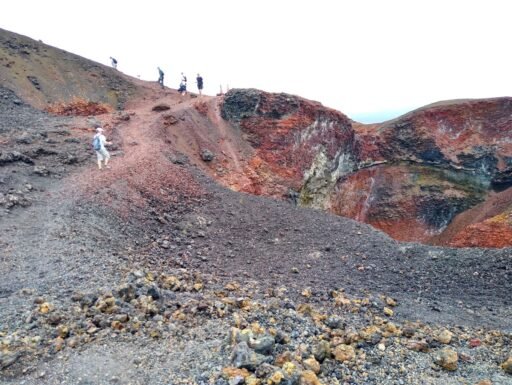 Walkers trekking on the Sierra Negra volcano in San Isabela, Galapagos