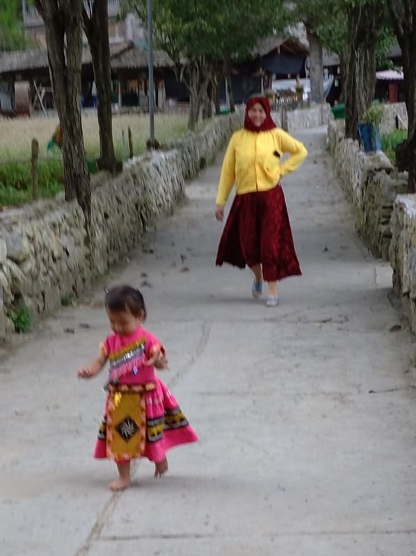 A Hmong woman and her child
