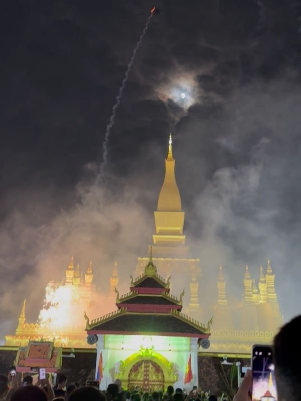 The full moon appearing with the fireworks to mark the end of the festival