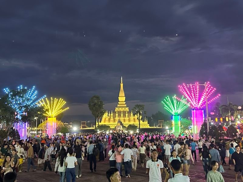 Crowds enjoying the festival around the stupa of That Luang